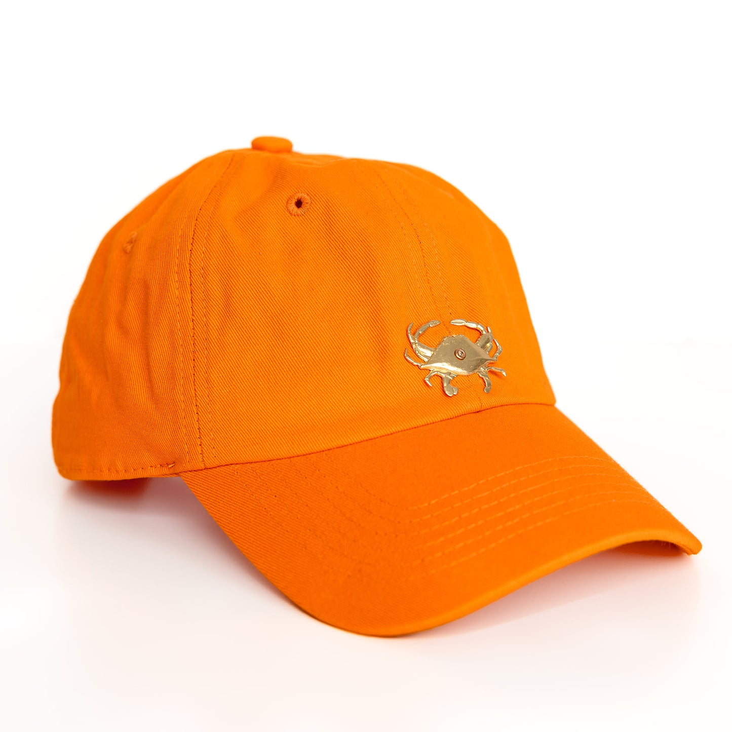 An orange baseball cap with a gold crab emblem detail on the front.