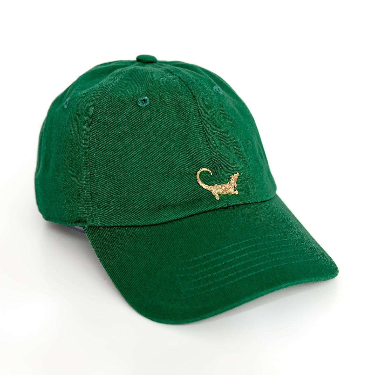 A green baseball hat with a gold alligator emblem on the front.