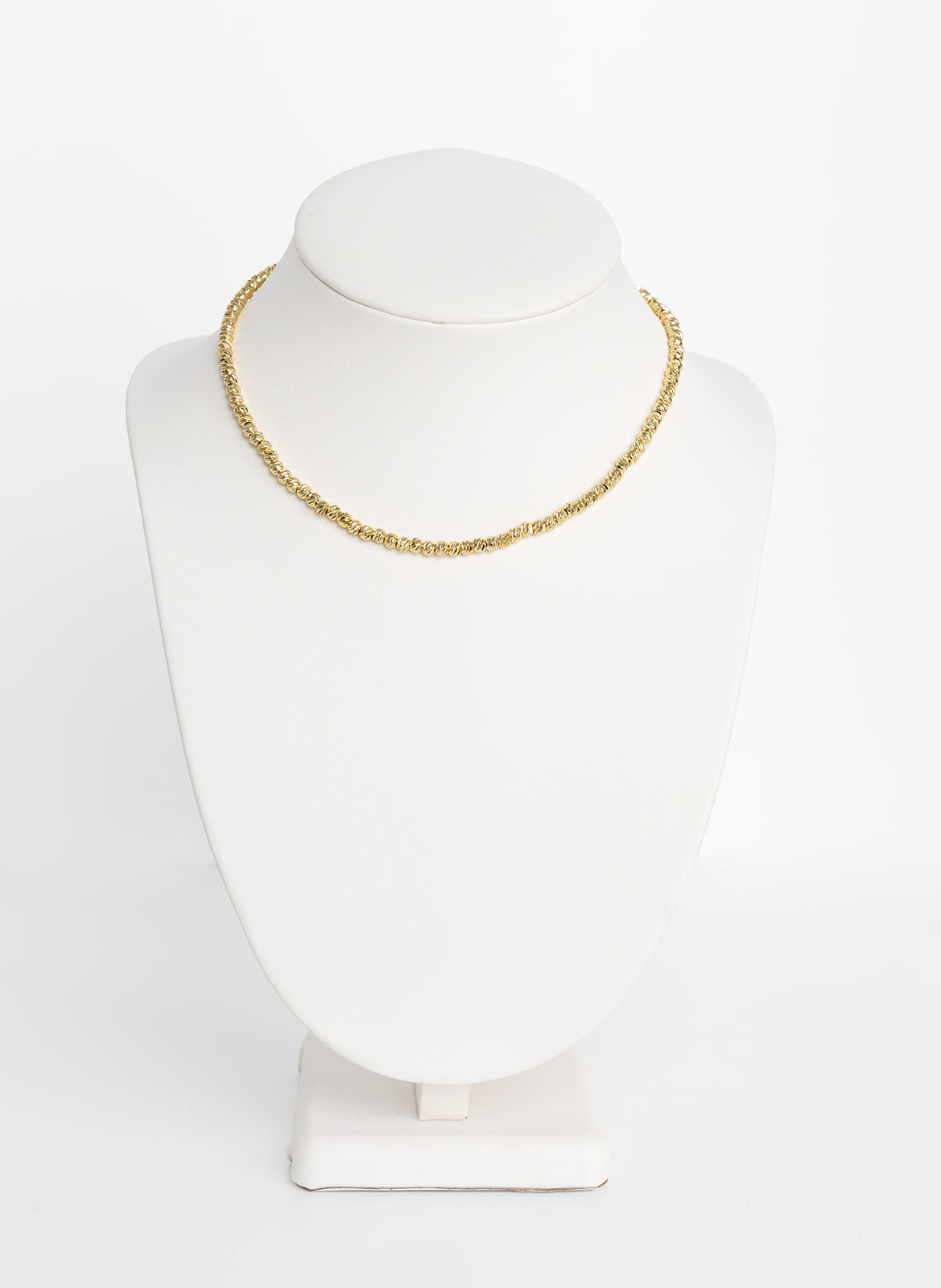 A 14-inch gold necklace chain displayed on a white mannequin bust.