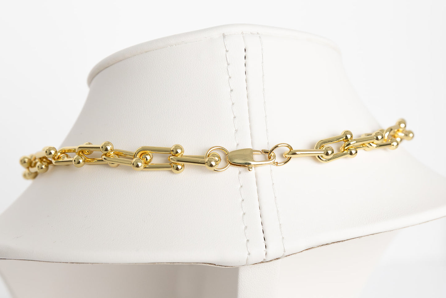 Gold horseshoe necklace with locket