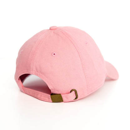 I pink baseball hat on a white backgorund