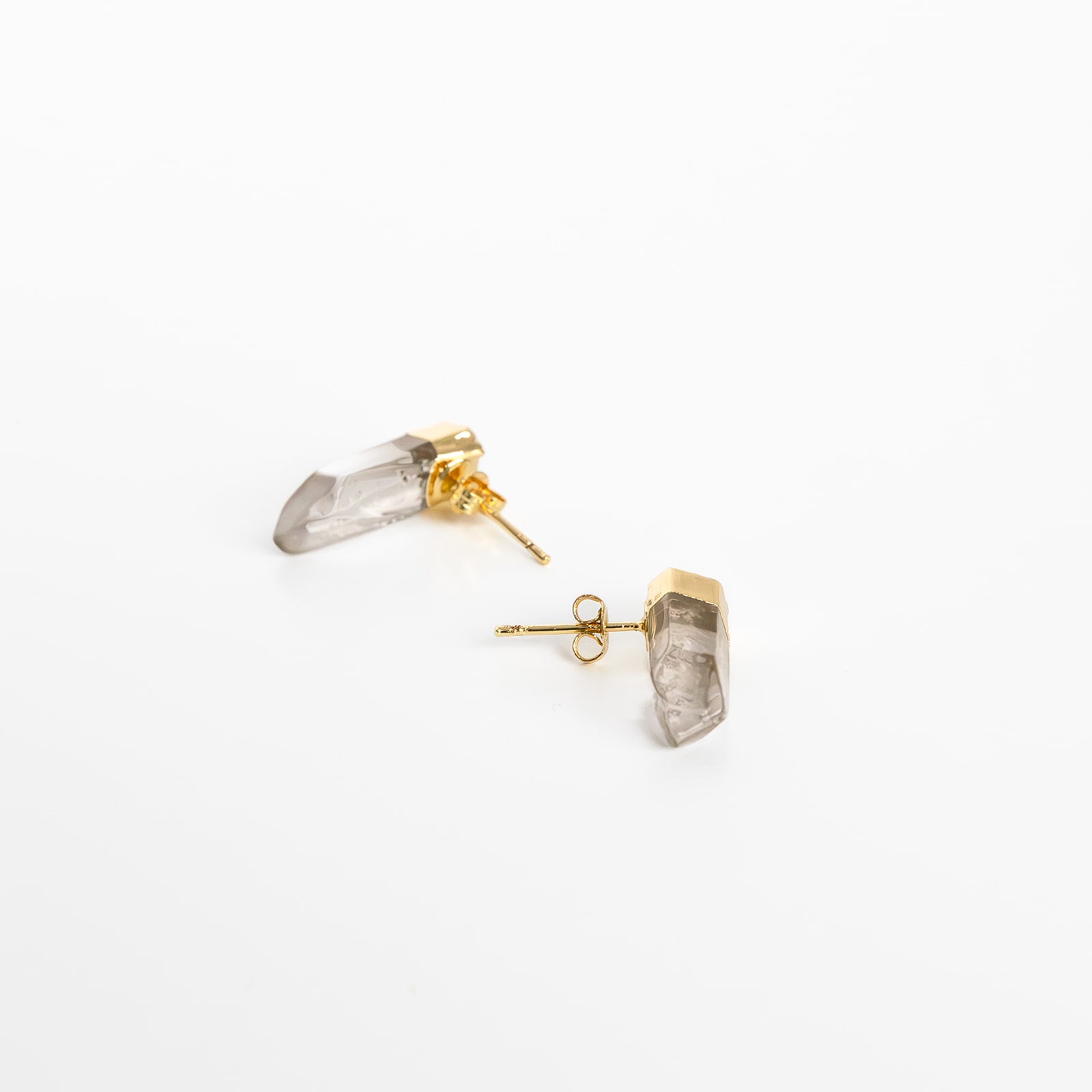 A pair of gold-colored pierce earrings