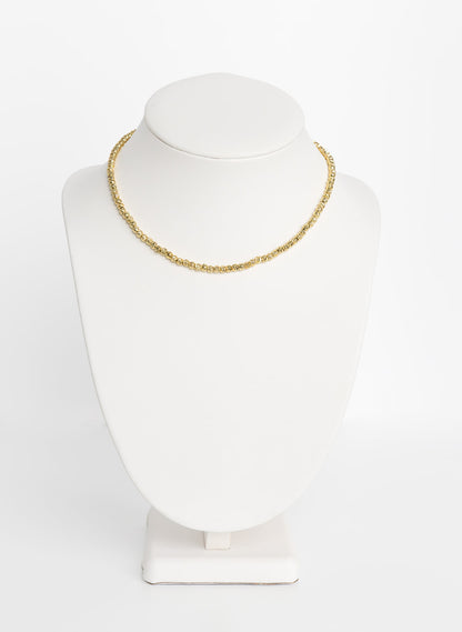 A 14-inch gold necklace chain displayed on a white mannequin bust.